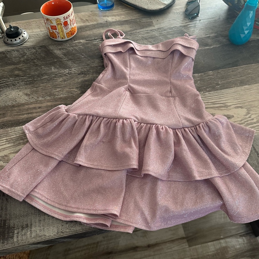 Sparkly pink dress with bow in the back.